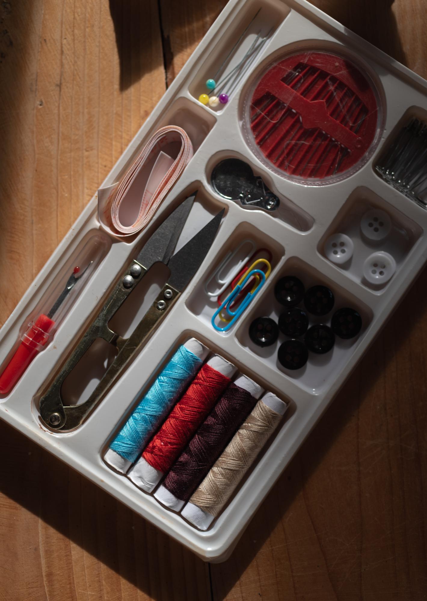 Workshop table with embroidered samples and tools