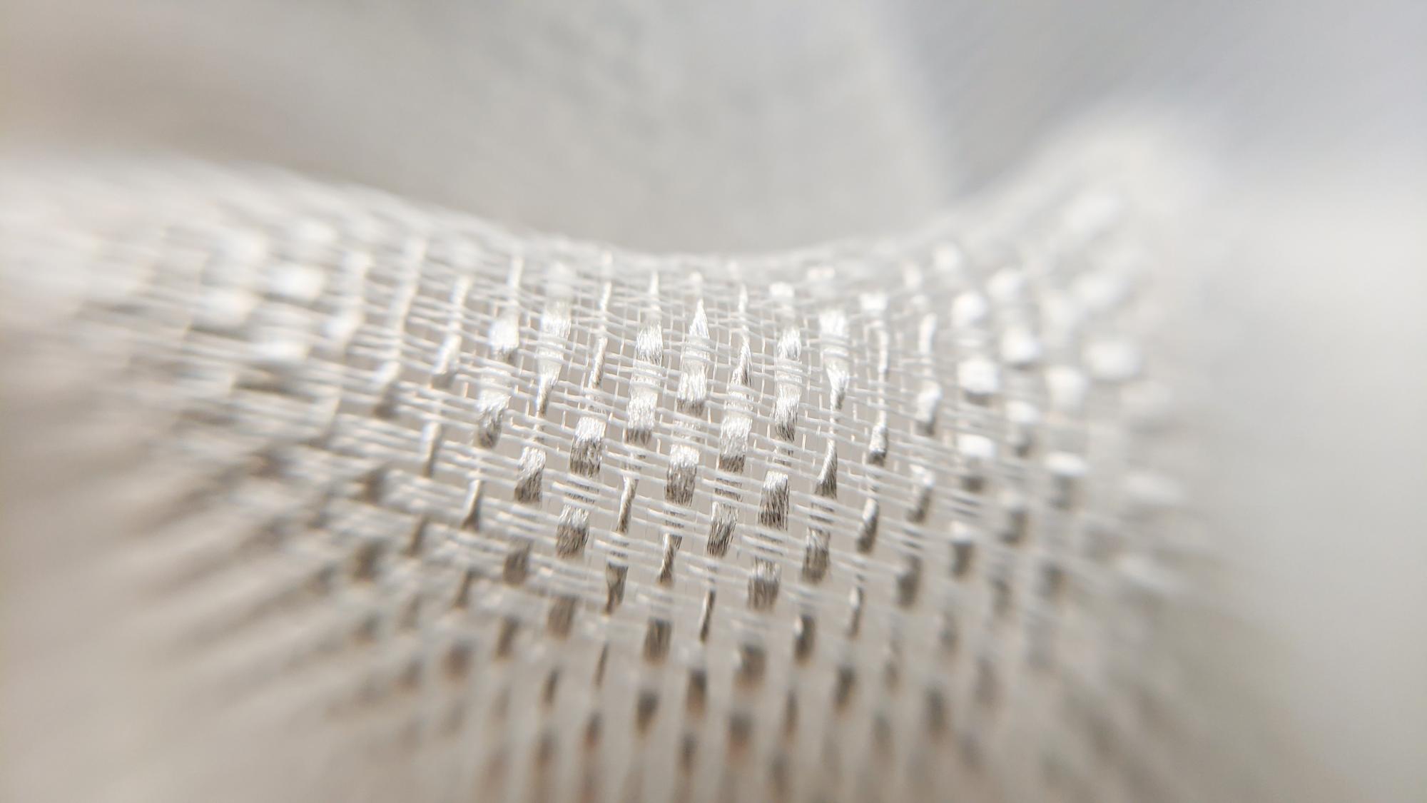 Close-up of high-tech embroidered fabric with metallic threads
